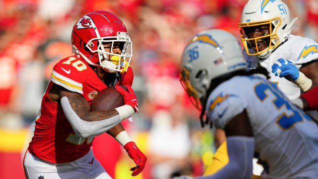 Oct 22, 2023; Kansas City, Missouri, USA; Kansas City Chiefs running back Isiah Pacheco (10) runs the ball against Los Angeles Chargers cornerback Ja'Sir Taylor (36) and defensive tackle Sebastian Joseph-Day (51) during the first half at GEHA Field at Arrowhead Stadium. Mandatory Credit: Jay Biggerstaff-USA TODAY Sports  